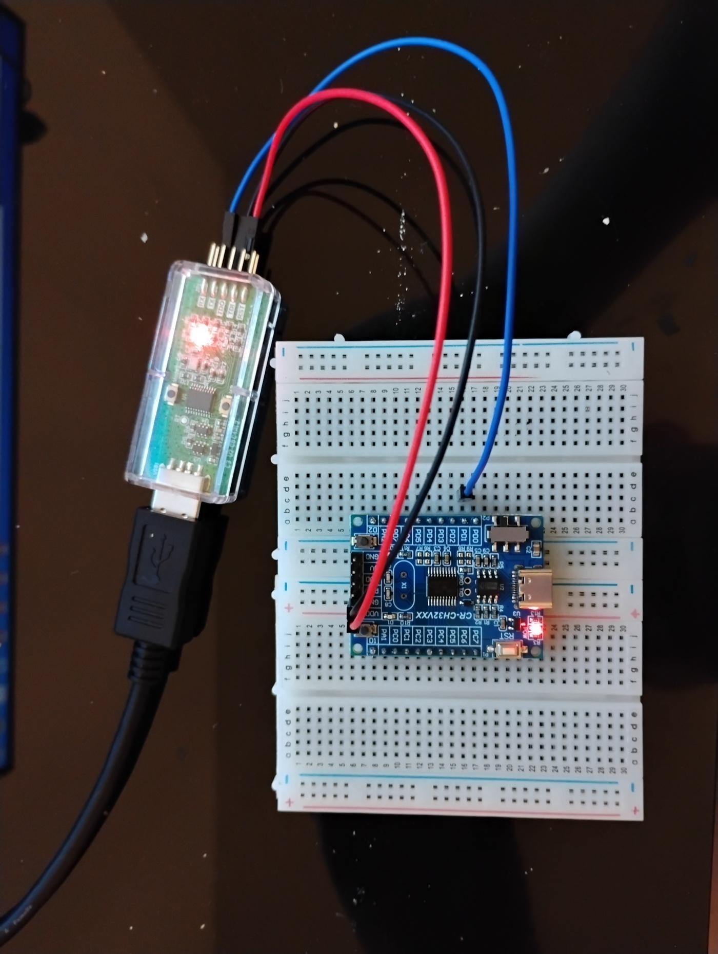 WCH-LinkE wired to a CH32V003 board on a breadboard